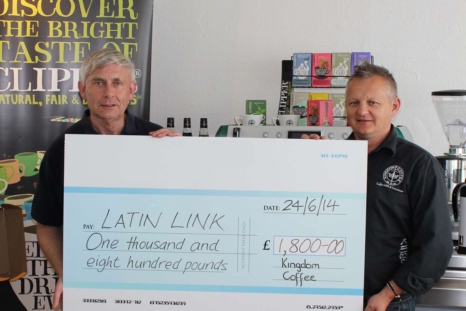 Jonathan Leeson, pictured left, Latin Link’s Area Representative, receiving the cheque from Darren Rayner of Kingdom Coffee