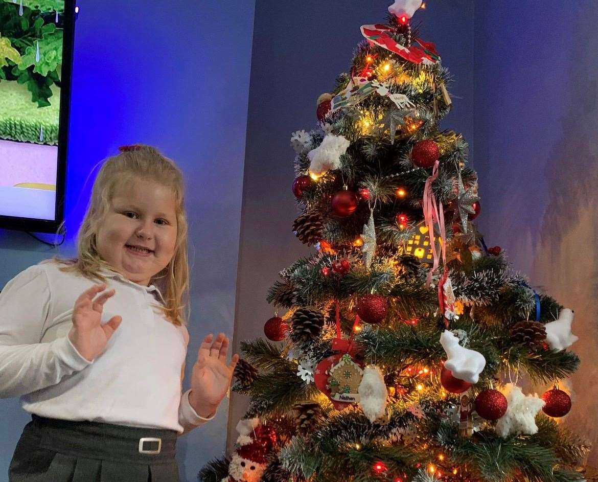 Maya Siek at home in Margate with the Christmas tree she decorated