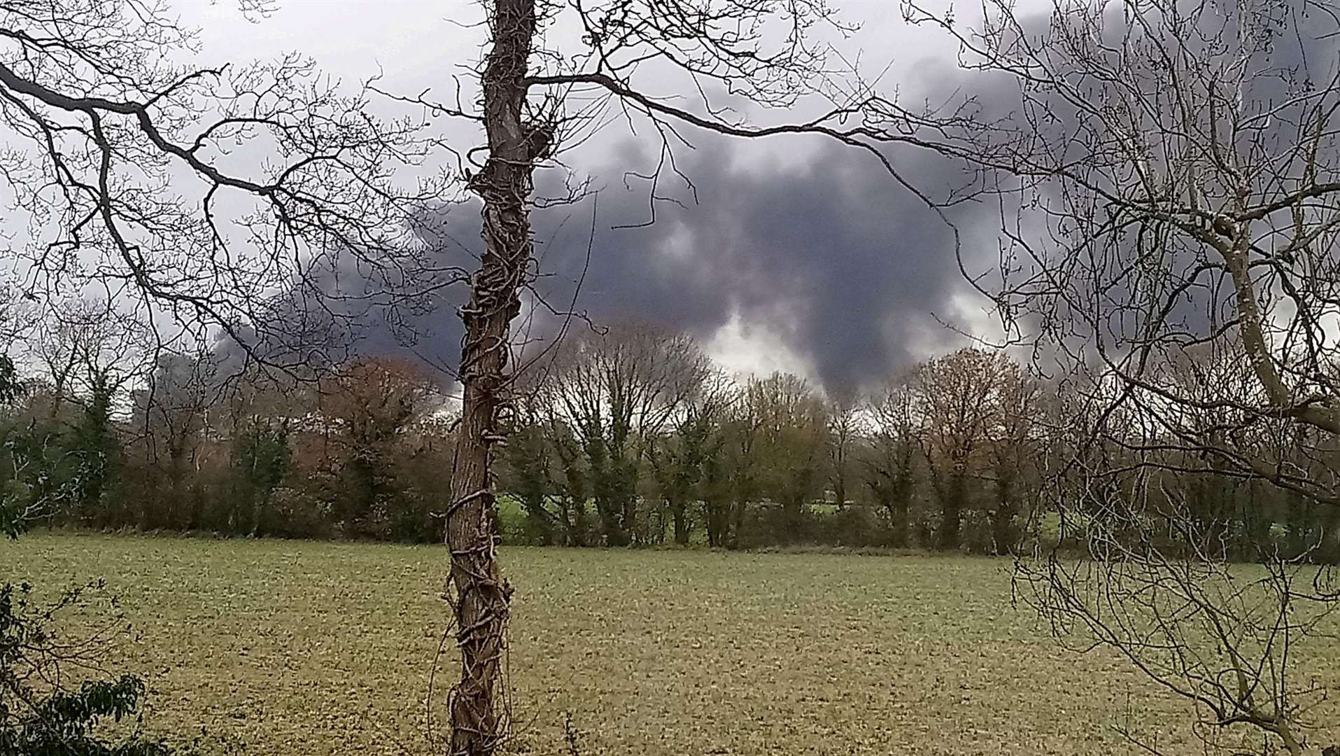 Black smoke can be seen as the plastic burns in Whetsted Road, Paddock Wood. Picture: Vicky Thompsett