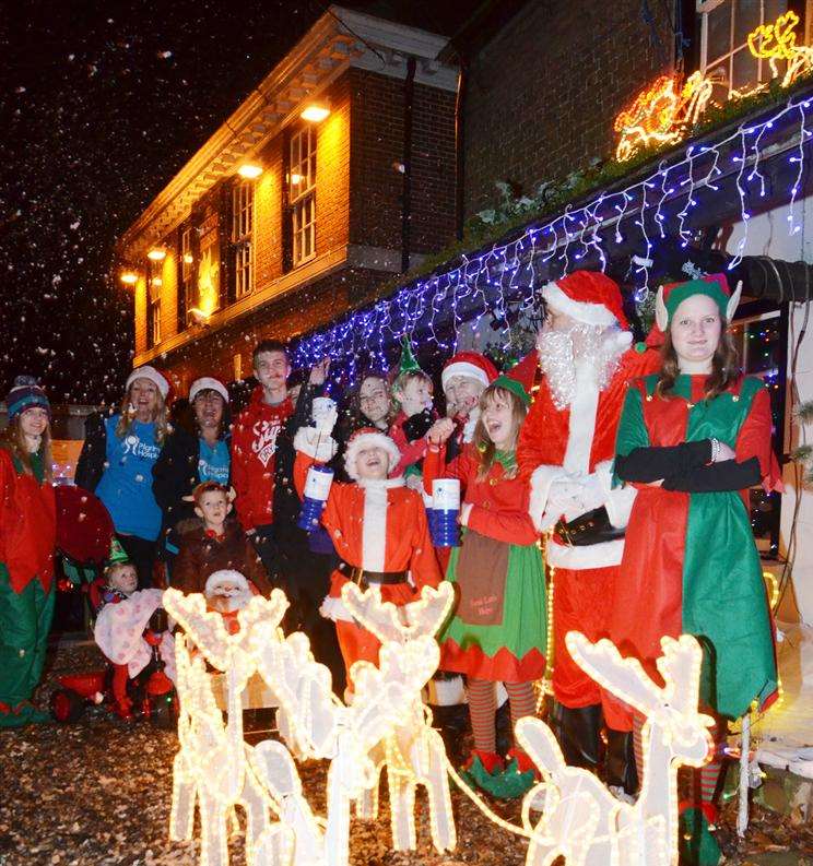 Gary and Kirsty Freer, their nine children and grandchild switched on the Christmas lights at their Ramsgate home to raise money for Pilgrims Hospices