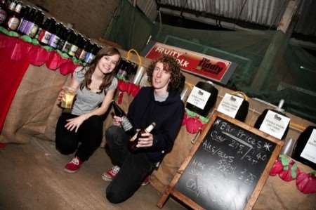 Carole Brooks and Owen Longuet from Tiddly Pomme drinks at the Brogdale apple festival