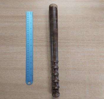 A man has been arrested after a wooden baton was found in a car