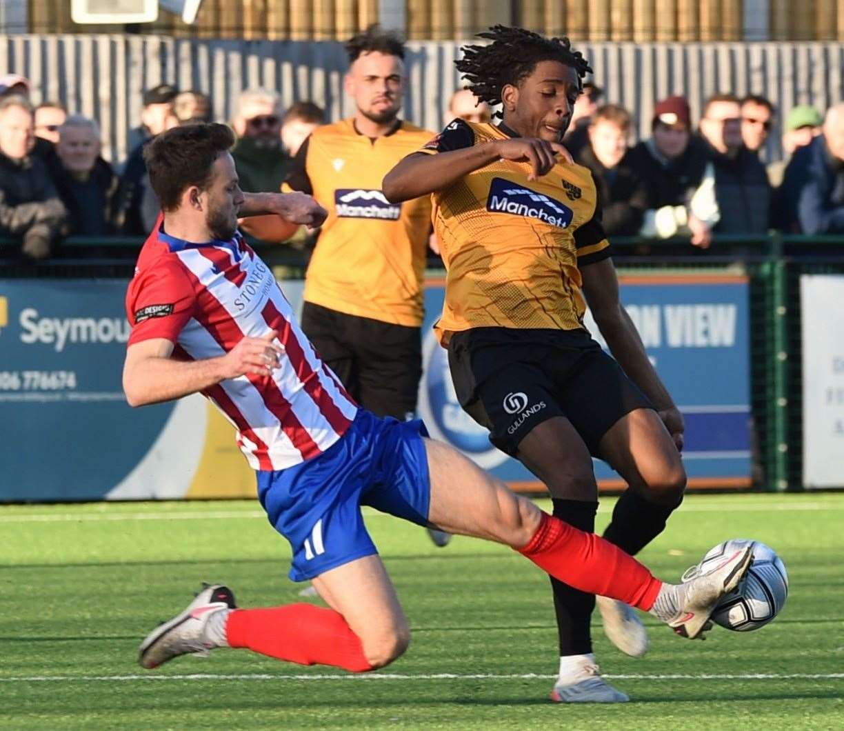 Dominic Odusanya in the thick of the action during Maidstone's defeat at Dorking. Picture: Steve Terrell