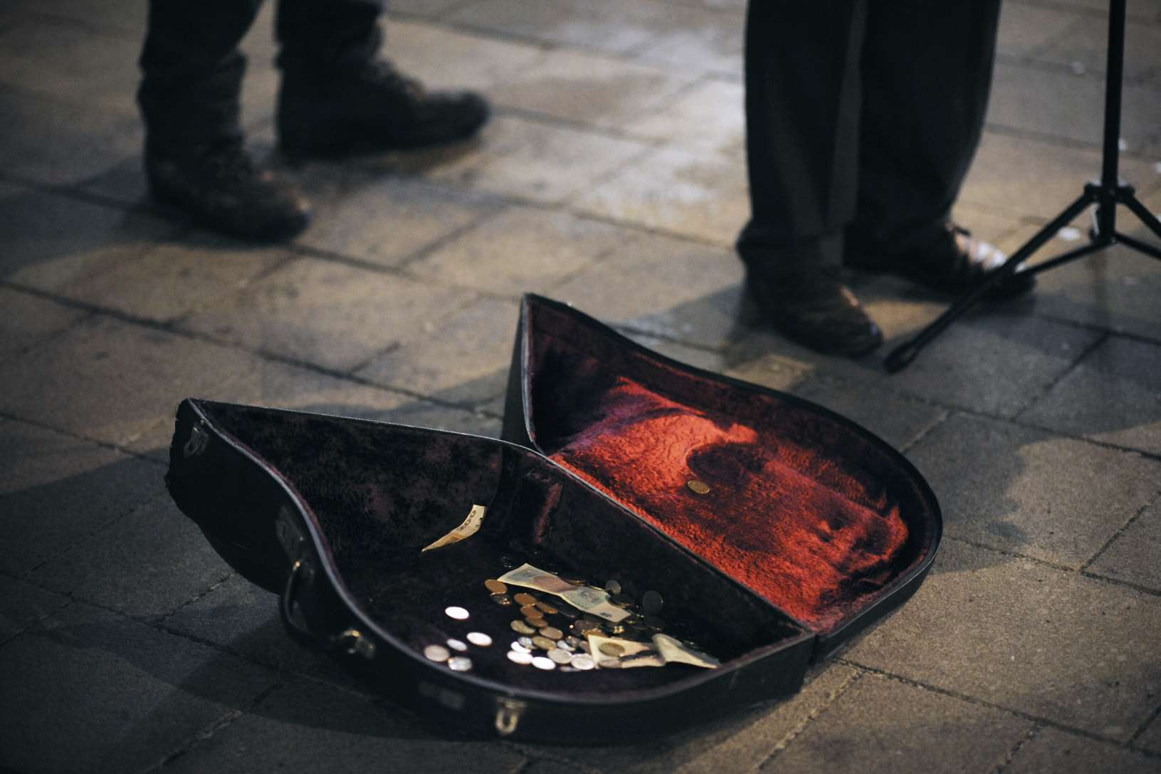 A busker collecting money