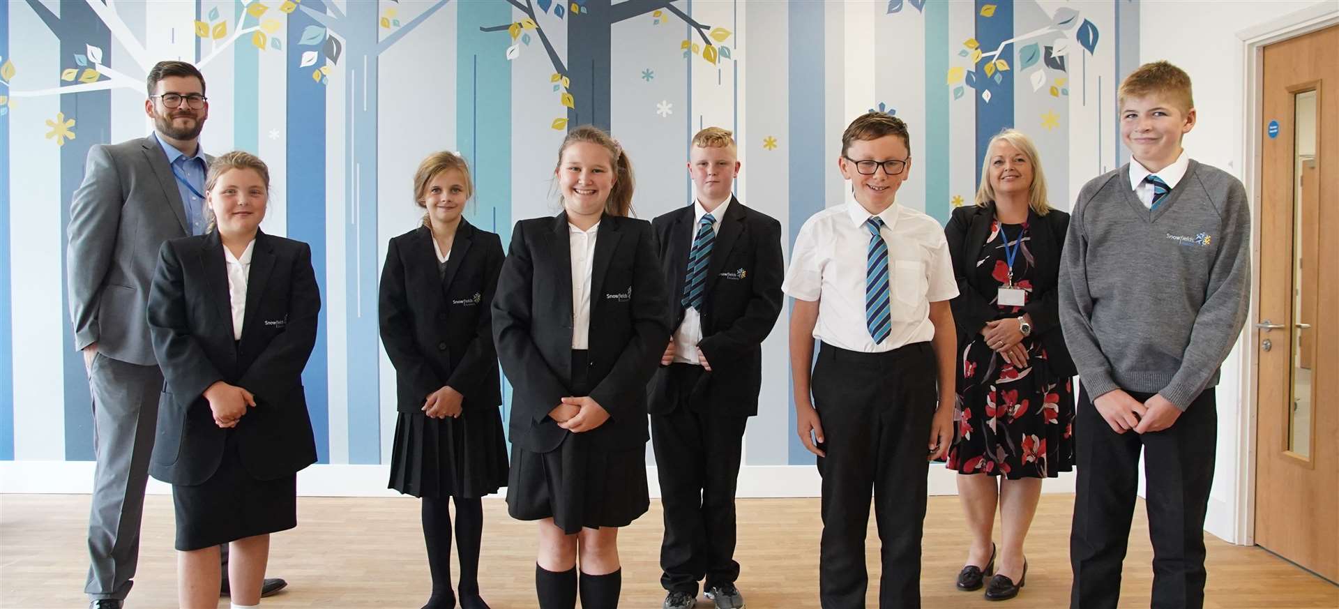 Snowfields Academy's opening day. Lottie, Molly, Neve, Harley, Jude and Joshua with James Doddington, Assistant Principal and Dee Pickerill, Principal.