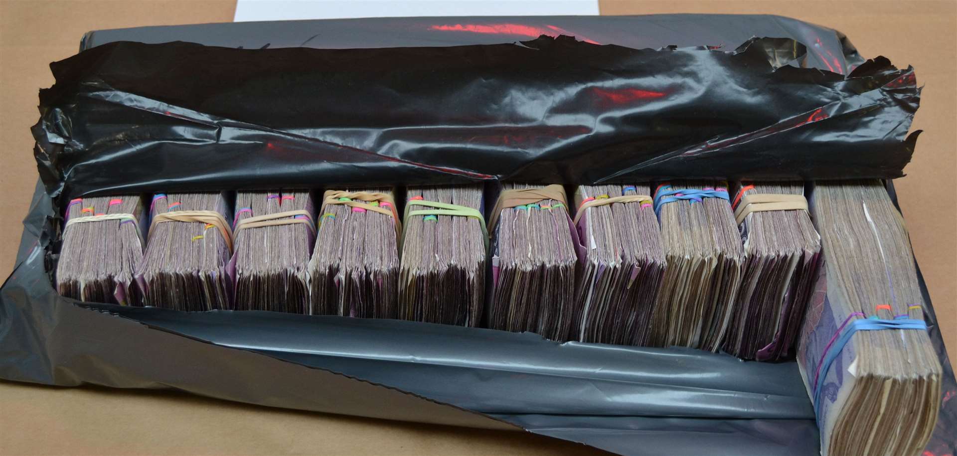 Cash totalling more than £850k found by Border Force officials at the Channel Tunnel in Faisal Khan's van. Picture: Kent Police