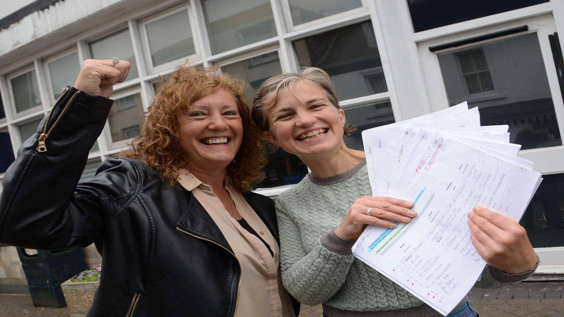 Lucy Duffy and Claire Pryke celebrate holding their 2,000 signature strong petition which aimed to stop Starbucks from coming to town