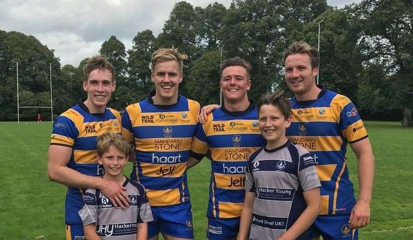 Max with his rugby teammates and brother Rudy. (8151180)