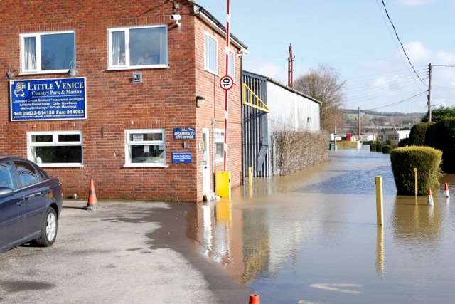 Waters lap up against businesses in Yalding. Picture: Matthew Walker