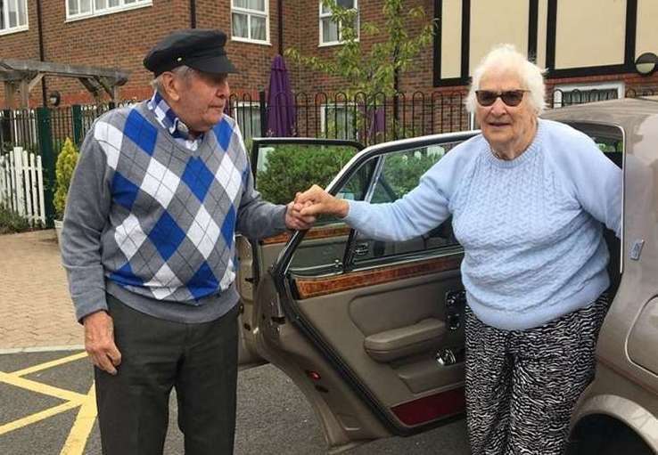 Alec Goy helping fellow resident Eve out of the Rolls-Royce (Care UK’s Weald Heights/PA)
