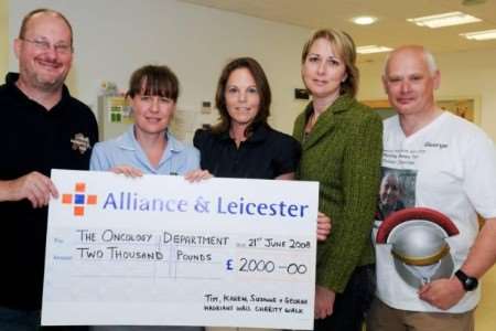 Tim Matthews, Sally Bridger, from Lord North Ward at Maidstone Hospital, Suzanne Ashby and George Gittins at Maidstone Hospital. The group handed over money raised by a sponsored walk in memory of Gary Eves. Copyright: Submitted by Tim Matthews