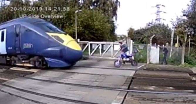 Footage released by Network Rail shows a near miss between a motorcyclist and a train at Shornemead Crossing near Gravesend