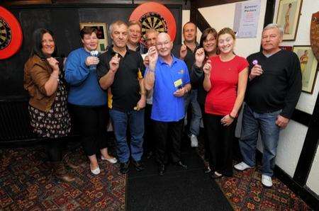Endurance darts players who took part in a 12-hour marathon for charity at the Gore Court Arms pub in Sittingbourne