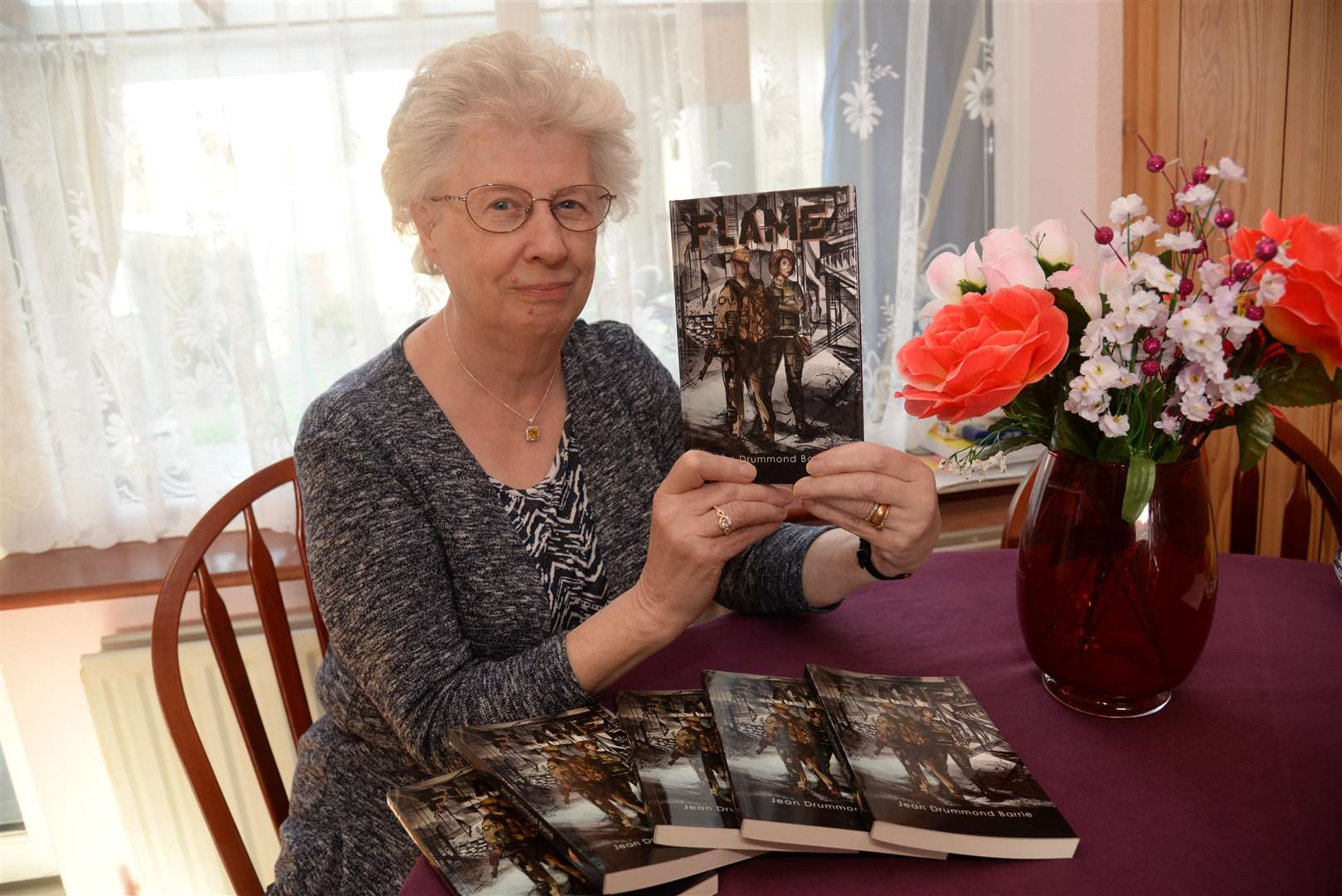 Jean with her book, picture Chris Davey