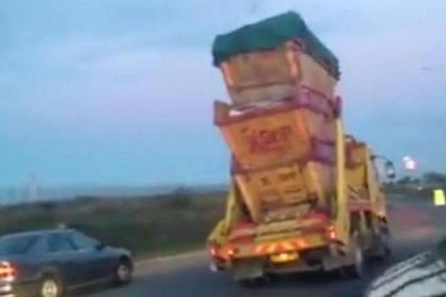 Motorists looked on in horror as a truck thundered by with three skips balanced on top in Ramsgate