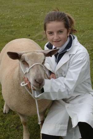 Katie Long, from Chilham, with her reserve champion charolais sheep. Picture: Paul Dennis