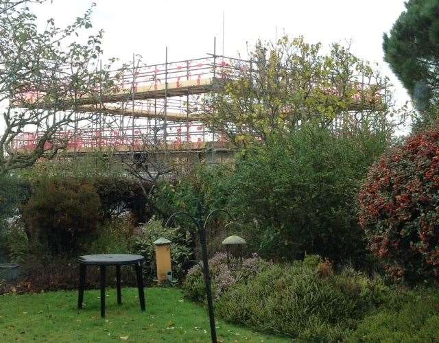The frame of the new house directly behind Kath Gifford's garden in New Cross Lees in Sandwich