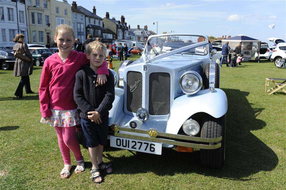 Amy Stretch, 10, and brother Sam, seven, pose with a Beauford at Deal Motor Show