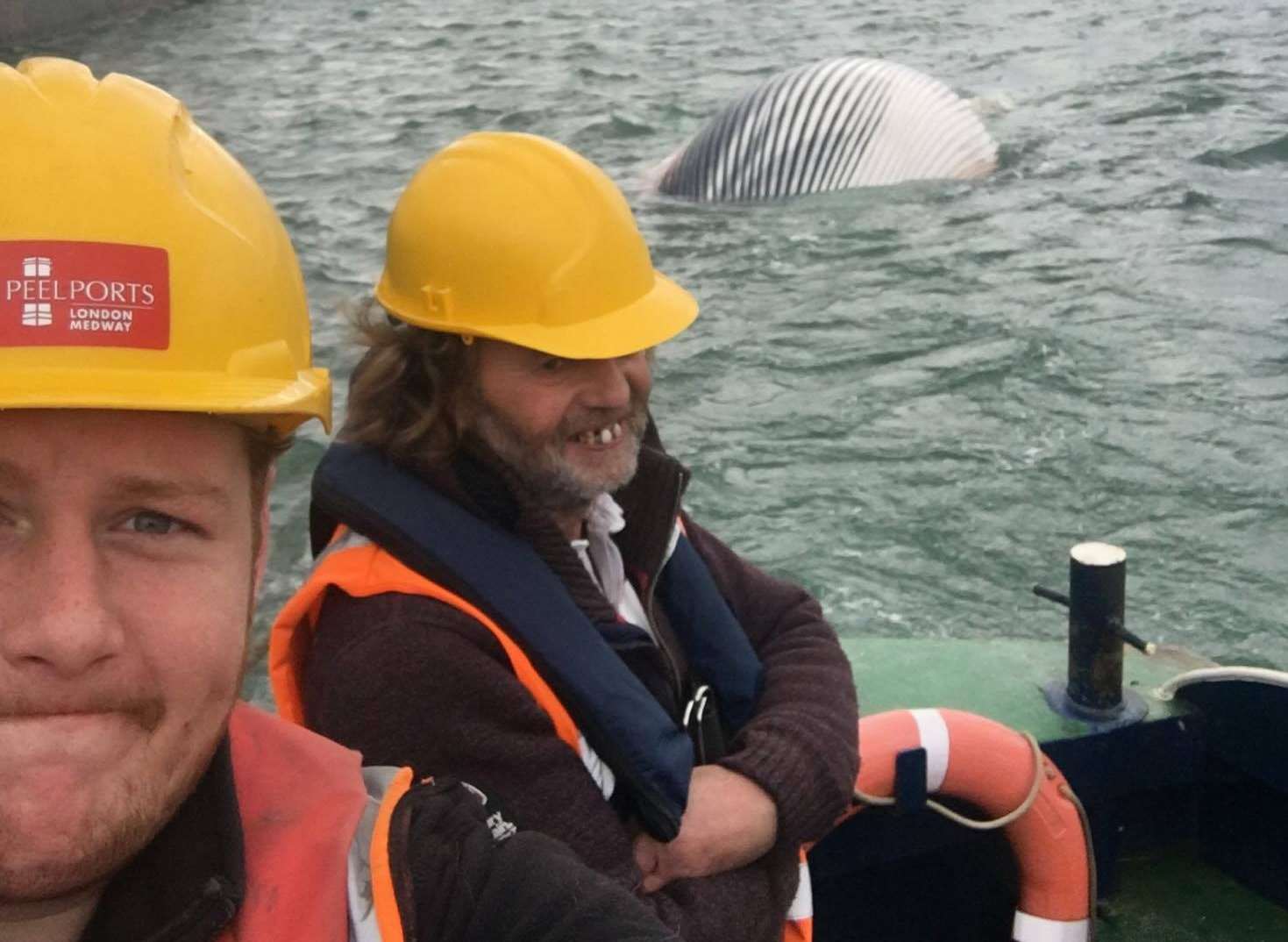 Jack Smedley and Peter Sands towing the body of the whale