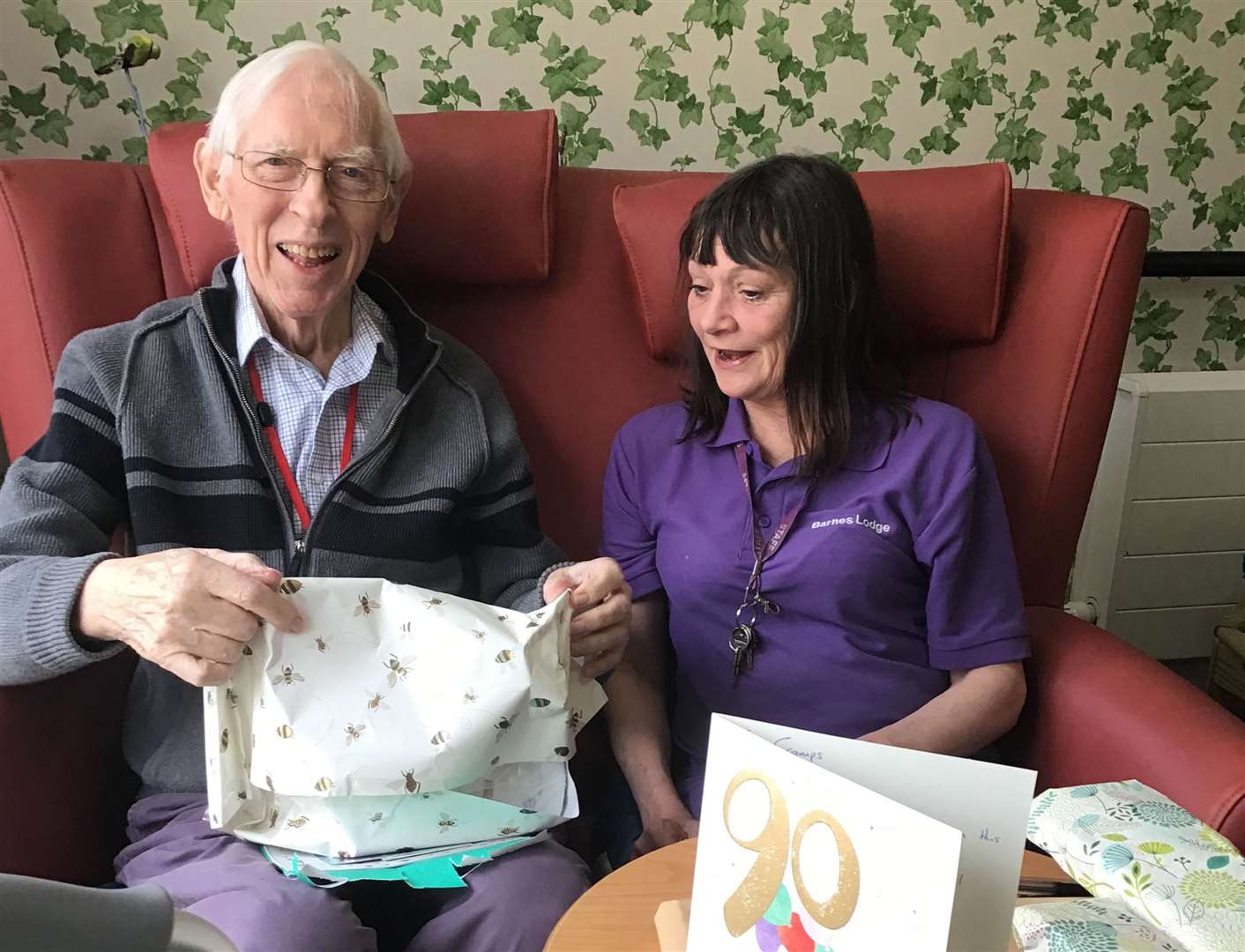 Jack Angus celebrates his 90th birthday with Barnes Lodge social activities facilitator Kay Hawkins