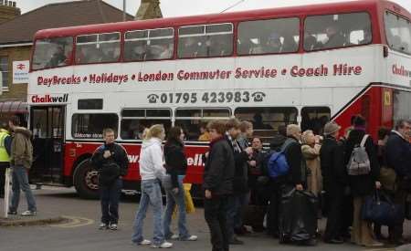 Passengers board buses to continue their onward journey. Picture: ANDY PAYTON