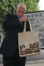 Town centre manager Bill Moss models the bag