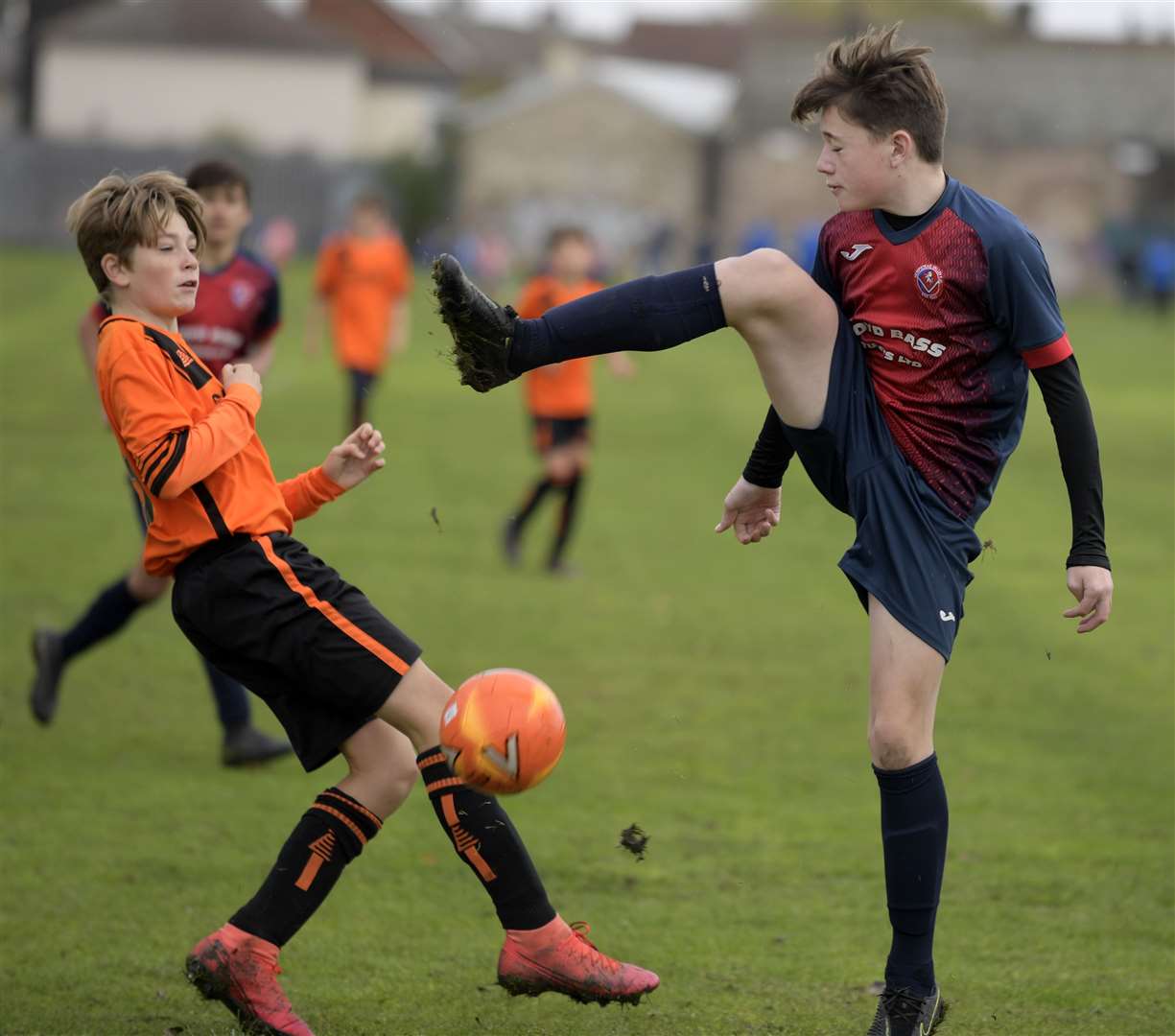 Hempstead Valley under-14s (blue) put their foot in against New Road under-14s. Picture: Barry Goodwin (42745152)