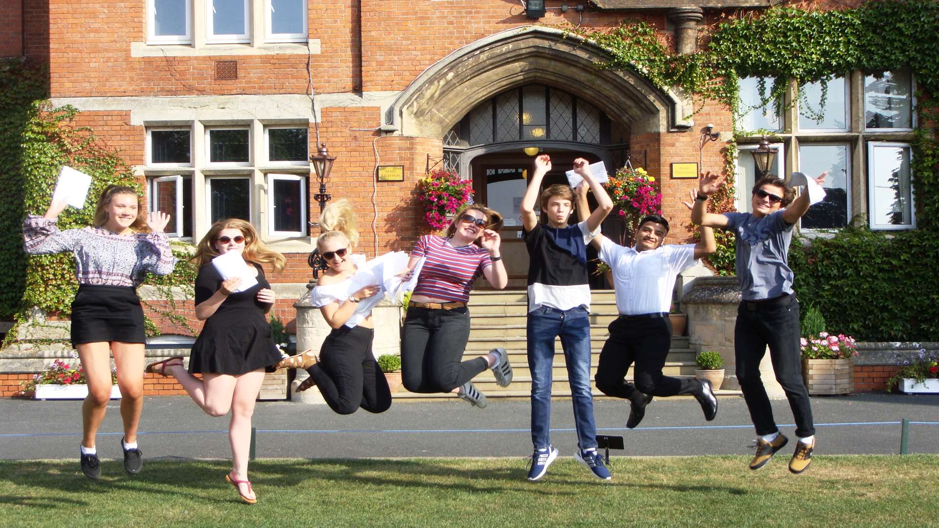 Hannah Martin, Catherine Dahms, Mary Peskett, Charlotte Wayman, Alex Mylonakis, Atharva Lad and Felix Mann celebrate their GCSE results at St Lawrence College