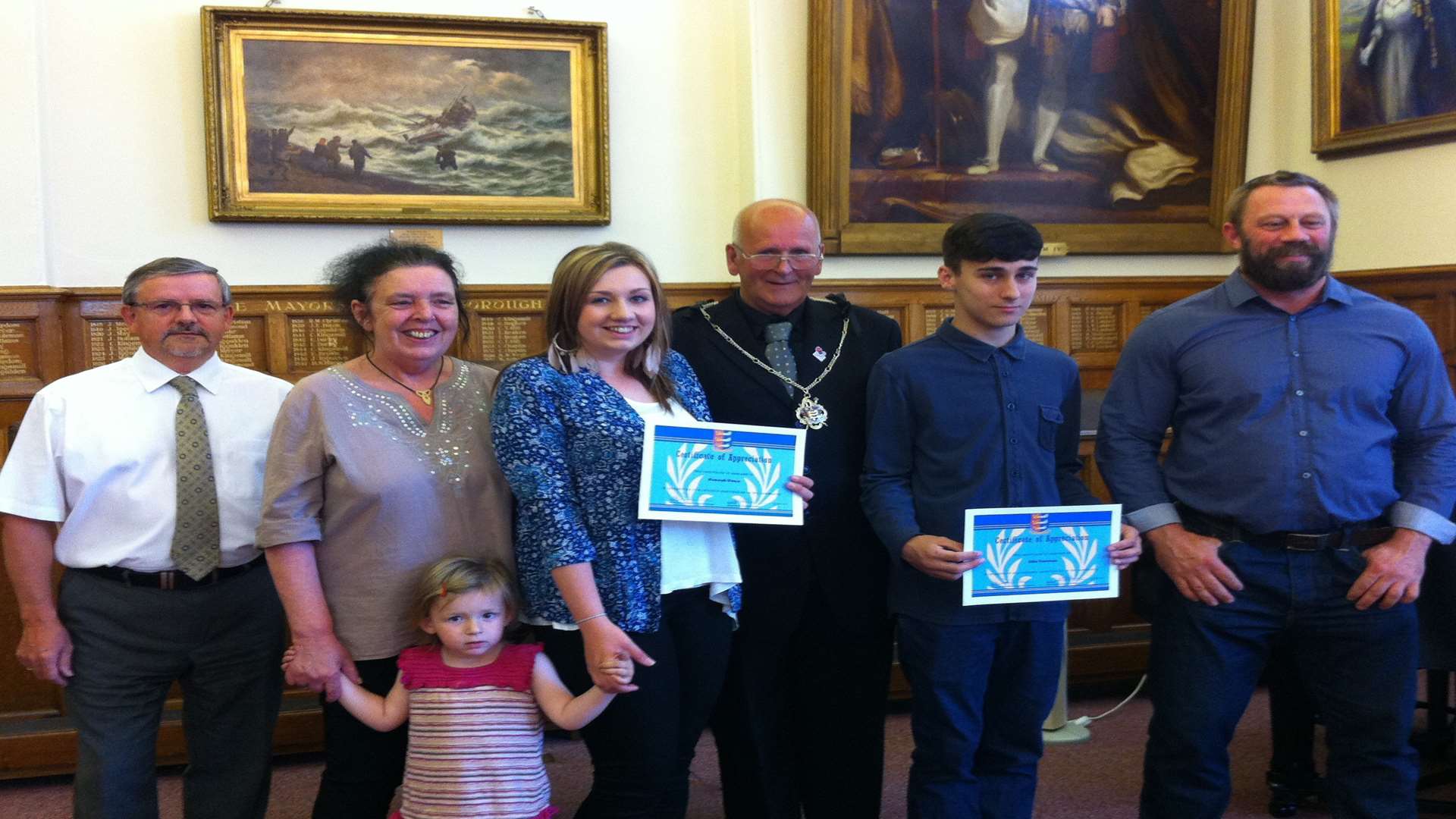 Hannah Dunn and Ellis Cureton with Deal town finance officer Paul Bone, parent Chrissi Dunn, Deal Mayor Cllr Adrian Friend, parent Carl Dunn and two-year-old Amelia Hadaway