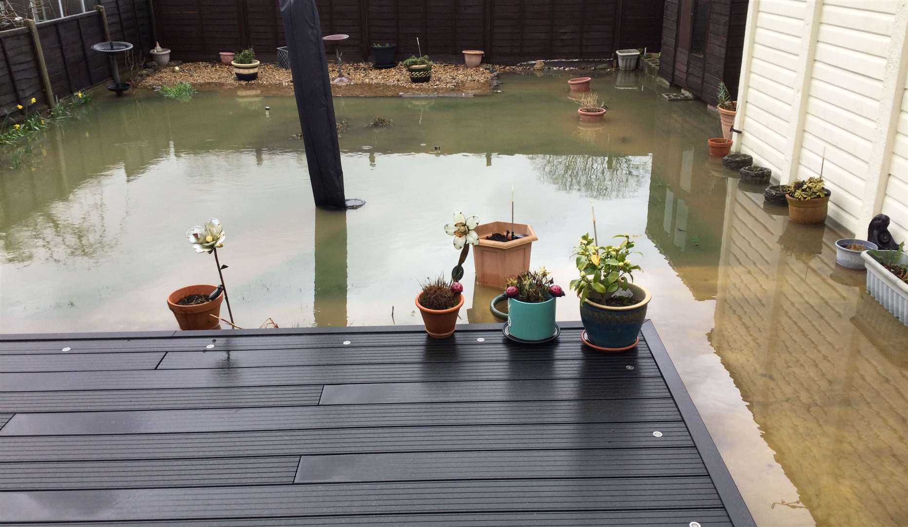 Flooding in Maureen Adaway's back garden; the water was close to entering her property in Hythe