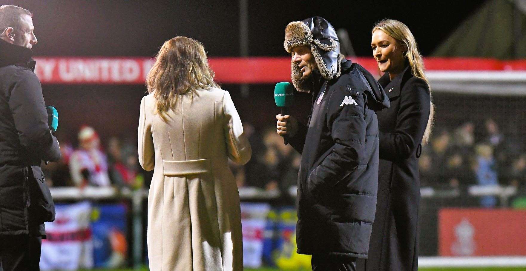Sheppey boss Ernie Batten is interviewed before kick-off by the ITV4 presenting team of Laura Woods, former England Lionness Karen Carney and Cray Valley manager Steve McKimm. Picture: Marc Richards