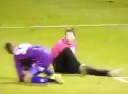 The Gills fan lands on the ground after attacking Wycombe keeper Jordan Archer