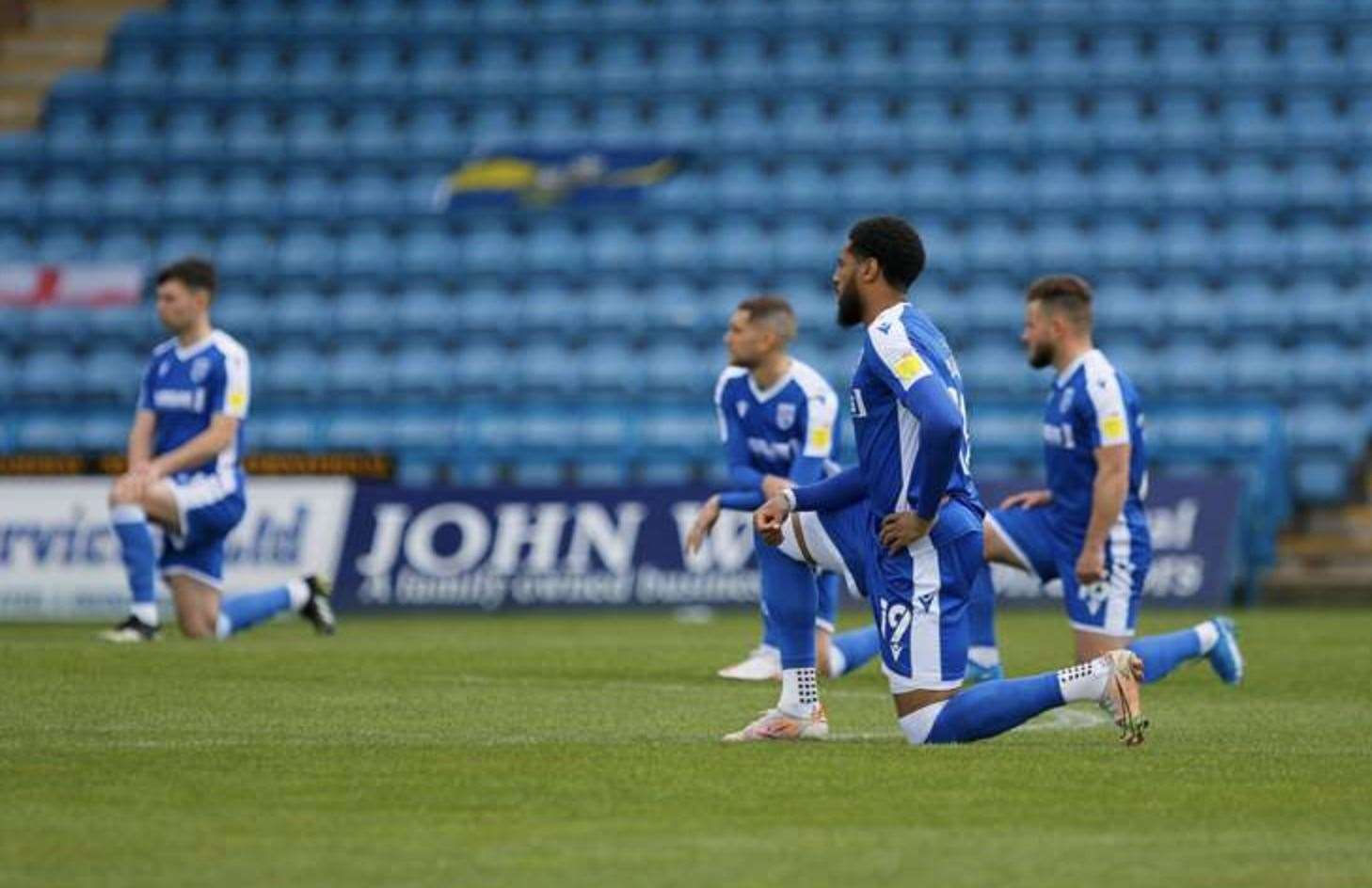 Gillingham FC players take the knee before a match