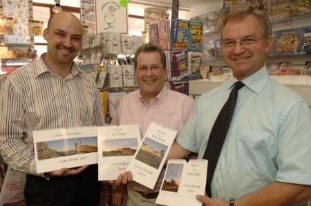 Keith Lee, from Demelza House, photographer Nigel May and Paul Winder, from Ropers, with the 2009 calendar