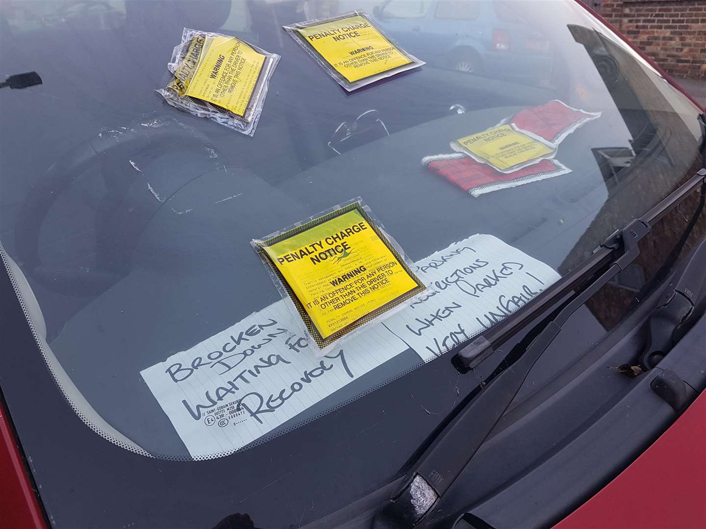 The driver has left notes on her dashboard