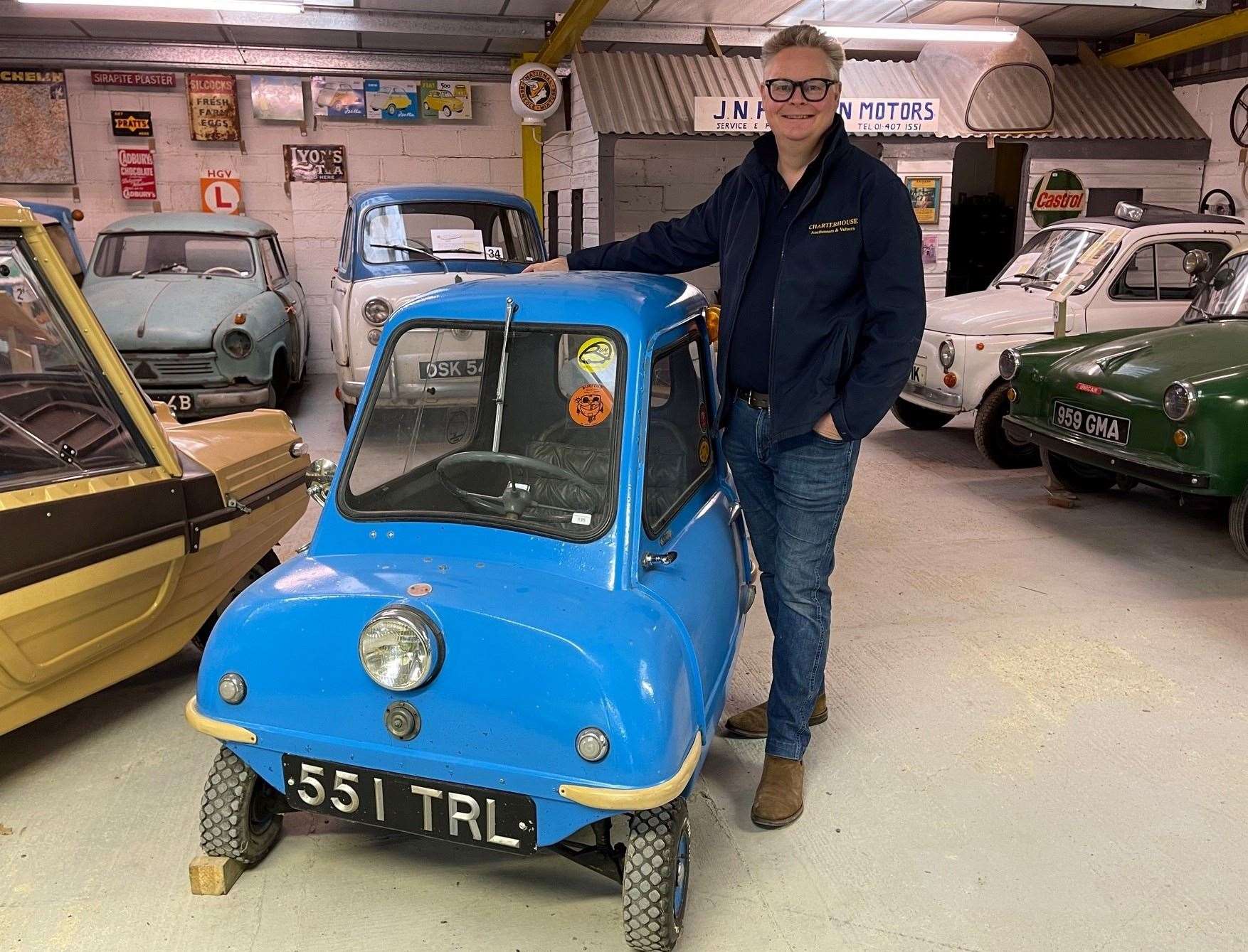 Richard Bromell, who auctioned off the cars, with the Peel P50
