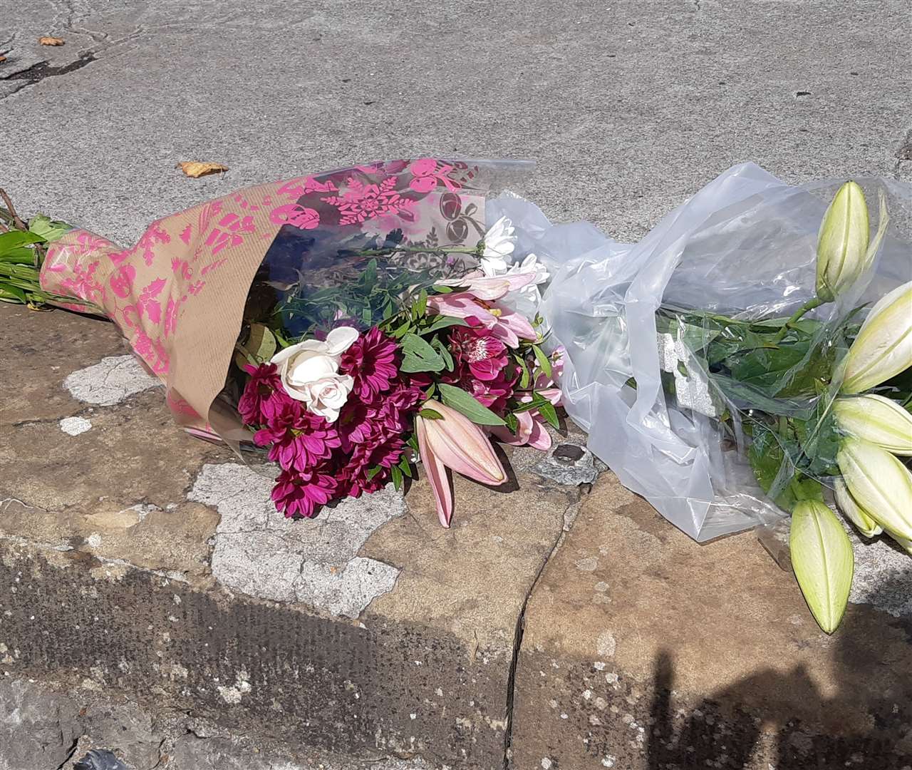 Floral tributes for the Queen have appeared opposite Rochester Castle. Photo: Sean Delaney