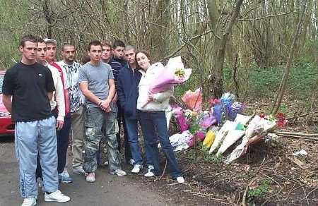 TRIBUTES: Friends gather at the scene of the crash. Picture: LIZZIE COOK