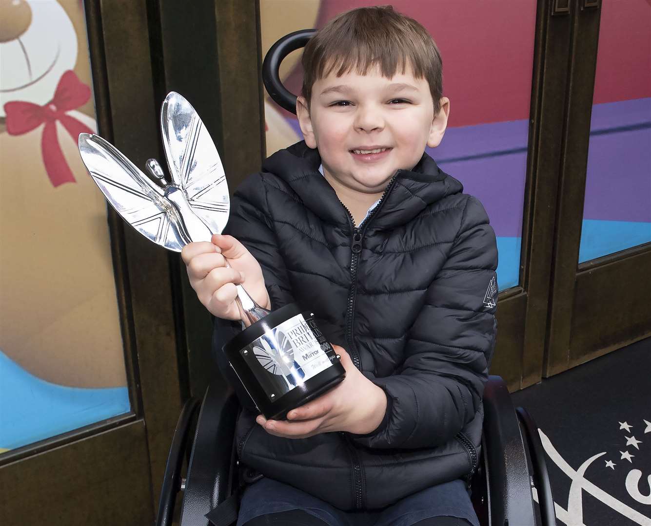 Tony Hudgell with his Pride of Britain trophy outside Hamleys Toy Shop in London. Picture: Phil Harris For Reach PLC/The Mirror