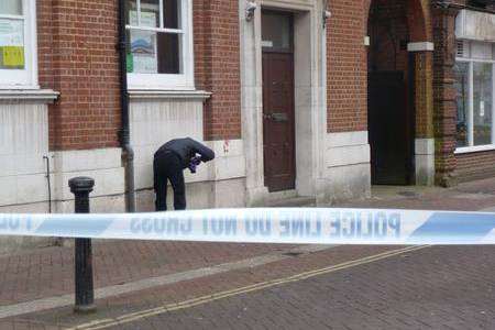Forensics officers gather evidence in Bank Street, Ashford, after a knife attack