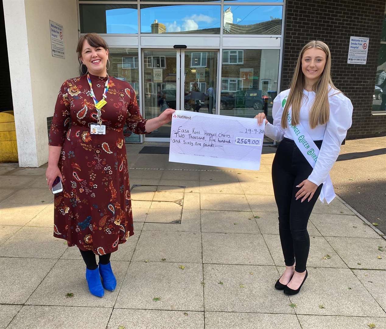 East Kent Hospitals Charity's fundraising and development officer Dee Neligan receives the cheque for £2,500 from Lara Lynch who set up an online pageant in memory of her granny Liz Masters