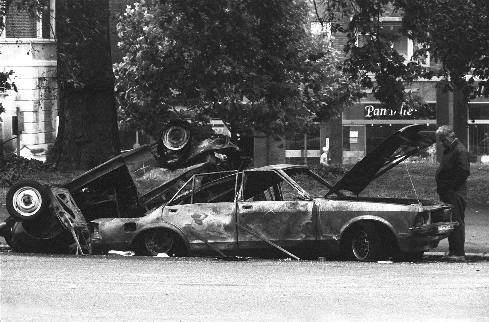 Police forensic officers working on the remains of the car which housed the Hyde Park car bomb in 1982 (PA)