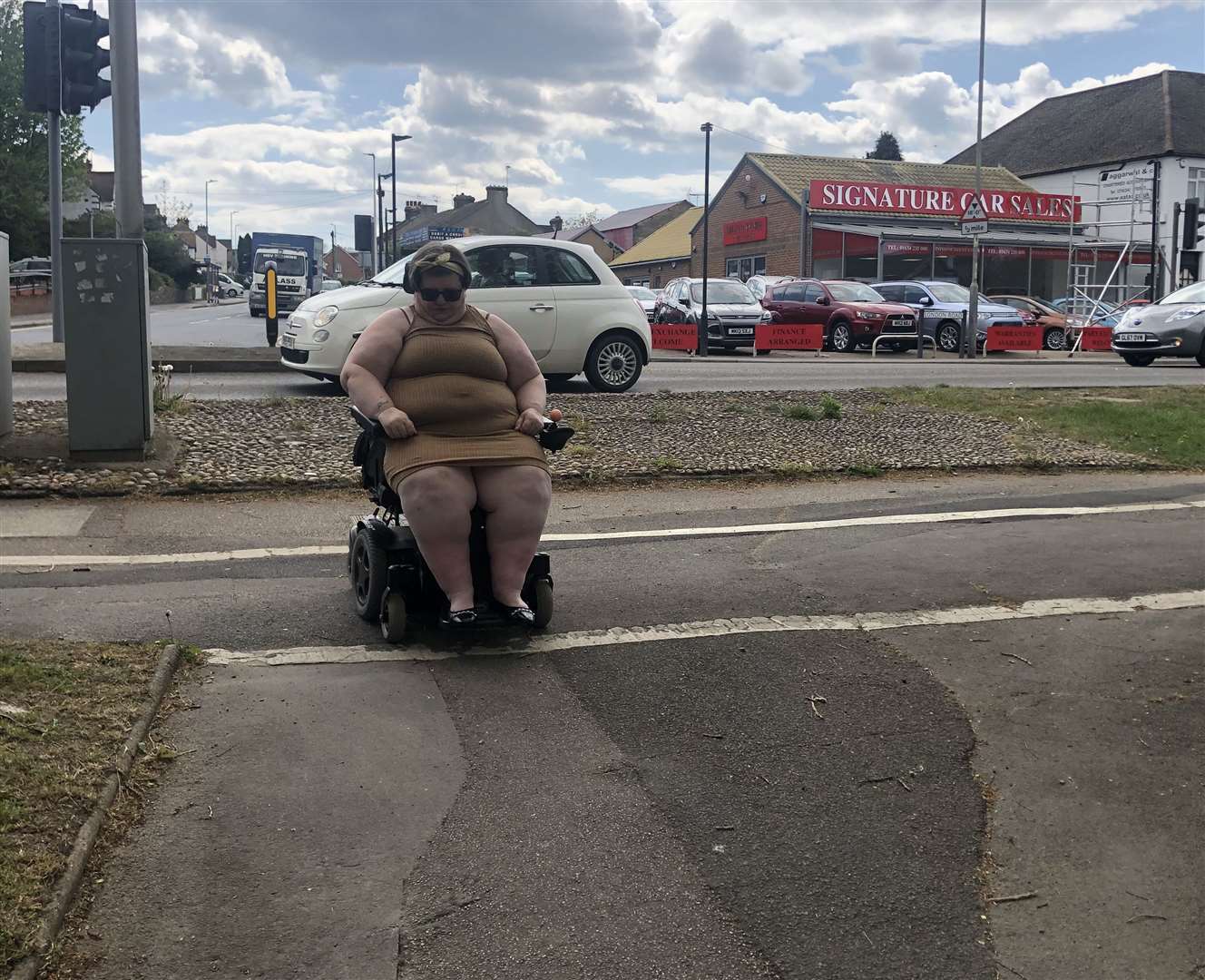 Sally cannot go down the path safely in her wheelchair