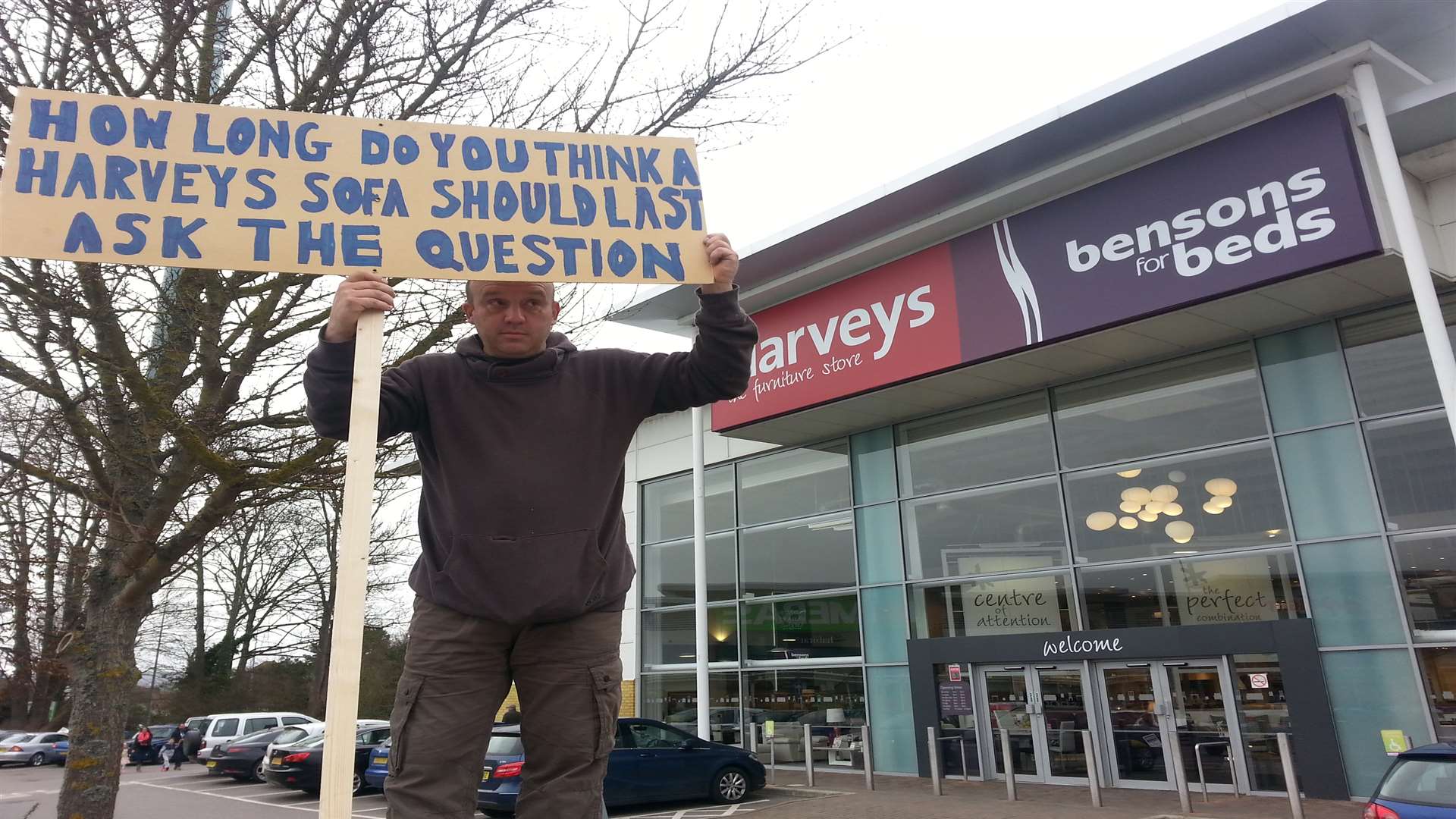 Ian Hayden, from Paddock Wood, staged a protest outside Harveys in Aylesford retail park. Picture by Martin Apps.