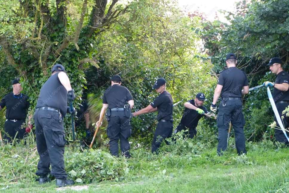 Police searching undergrowth near the Royal Military Canal in Hythe after a sex attack. Picture: @Kent_999s