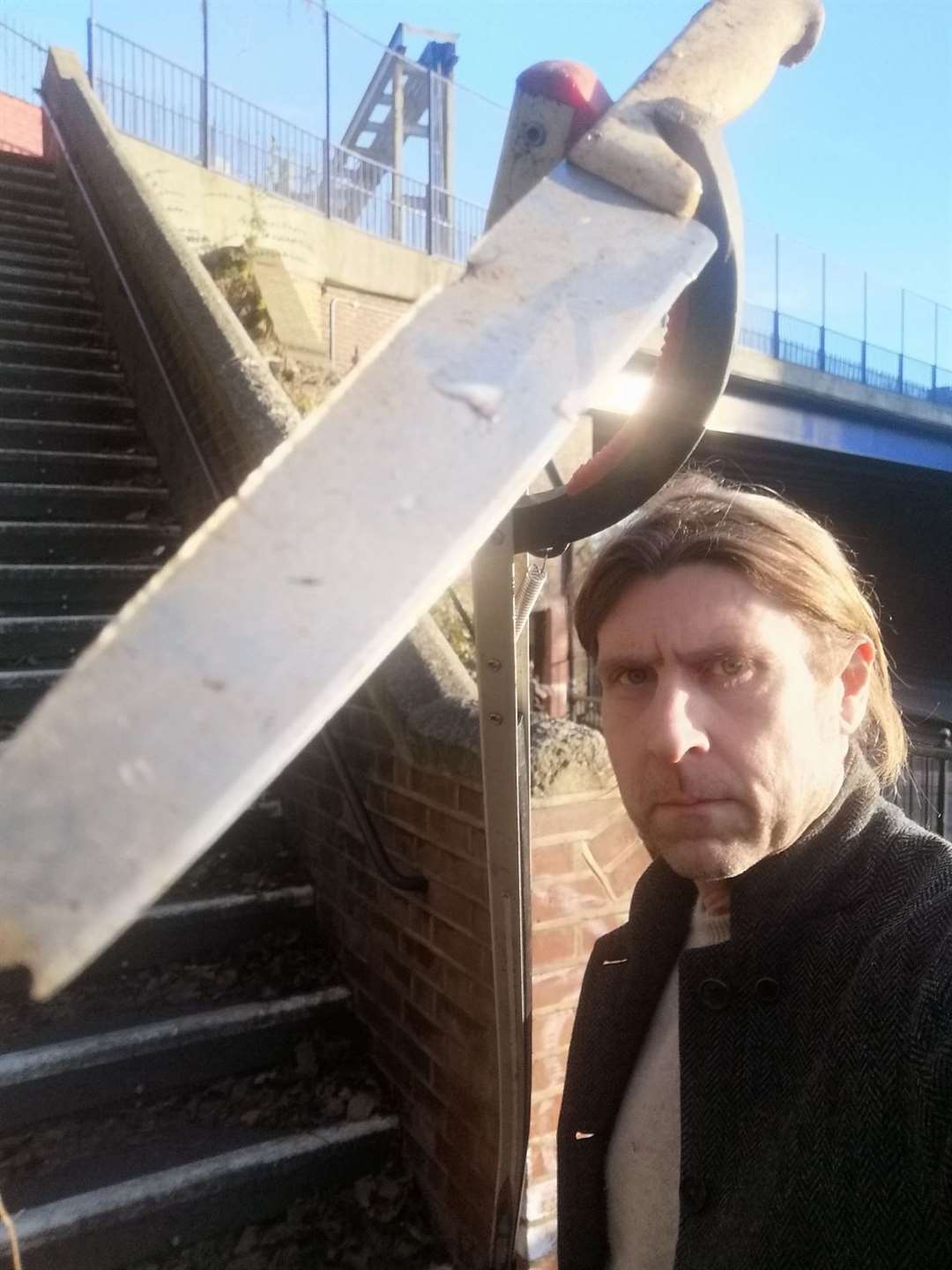 Tony Harwood with the blade found at Maidstone's High Level Rail Bridge