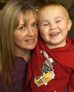 Tommy Warner with his mum, Debbie, after his first transplant in 2004. Picture: GRANT FALVEY
