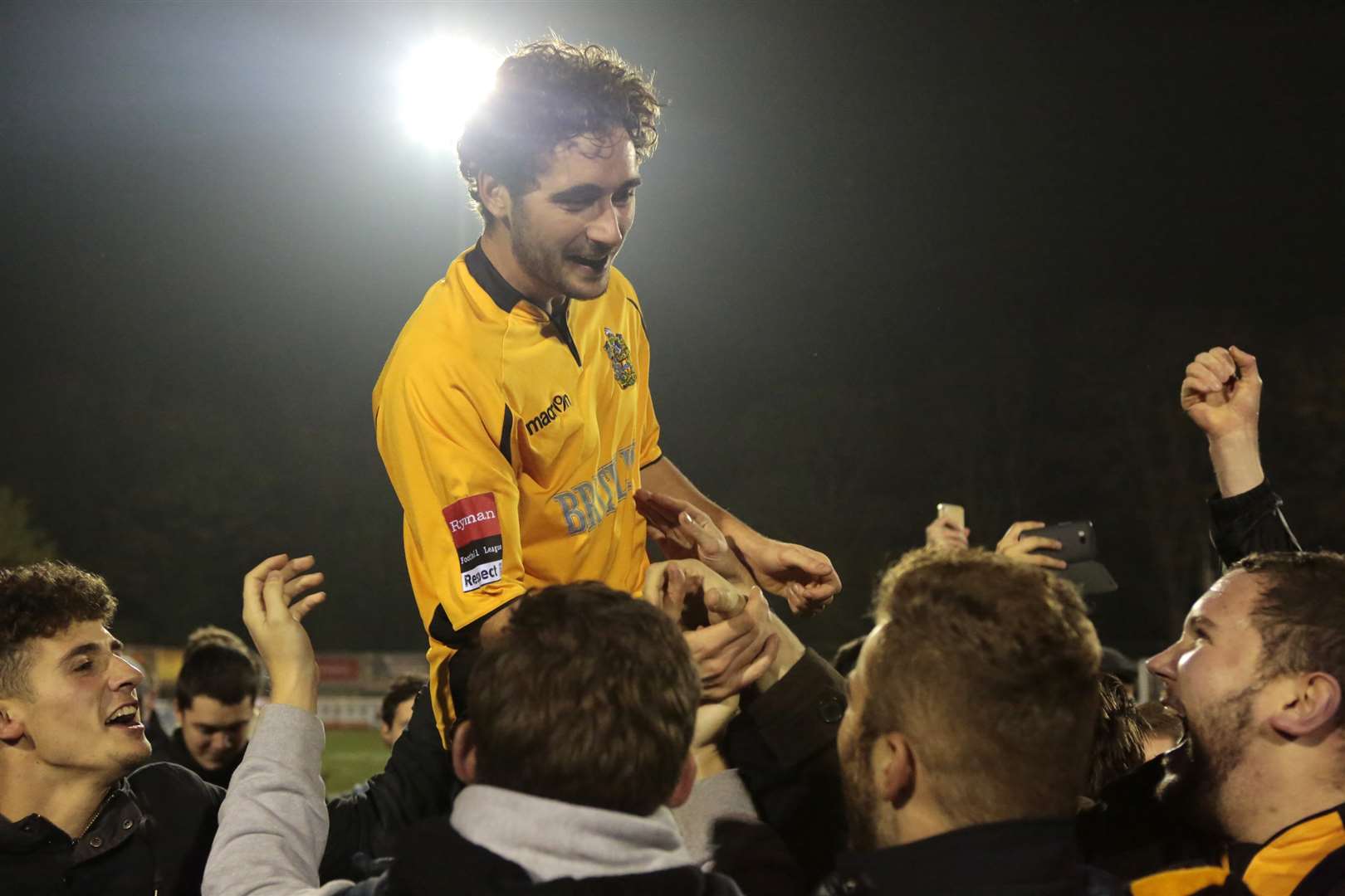 Alex Brown celebrates with Maidstone fans after the FA Cup victory over Stevenage last season Picture: Martin Apps