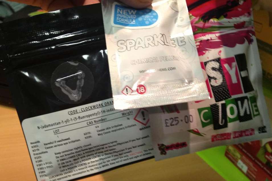 An array of legal high chemicals for sale in a shop
