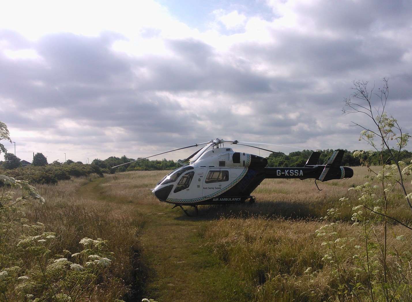 The air ambulance has landed near the Staplehurst crash site. Picture: Geoff Bew